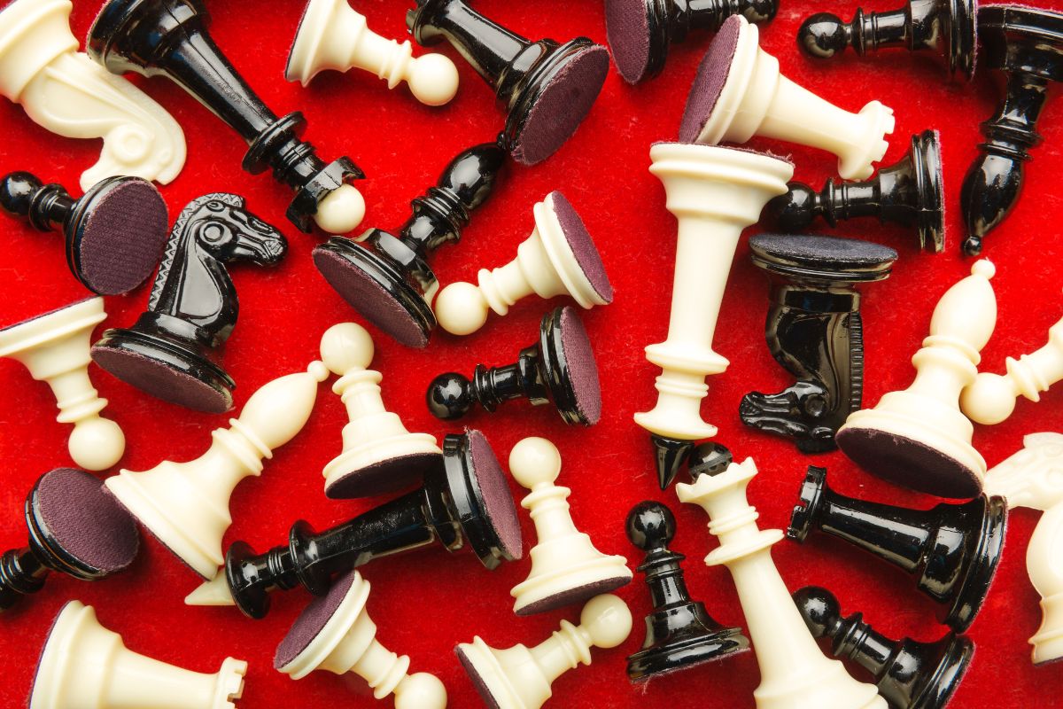 Chess figures on red background